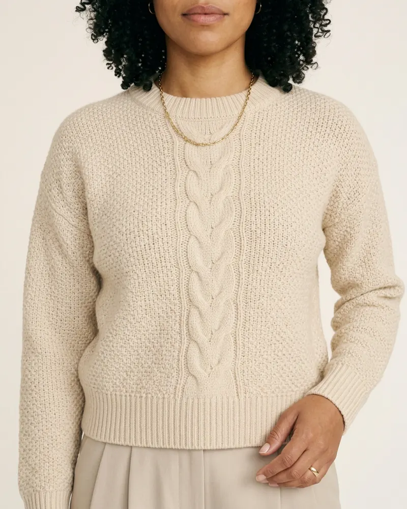Close-up of the Alnmouth Cable-Knit Jumper in Ecru: centre cable panel with moss-stitch sides