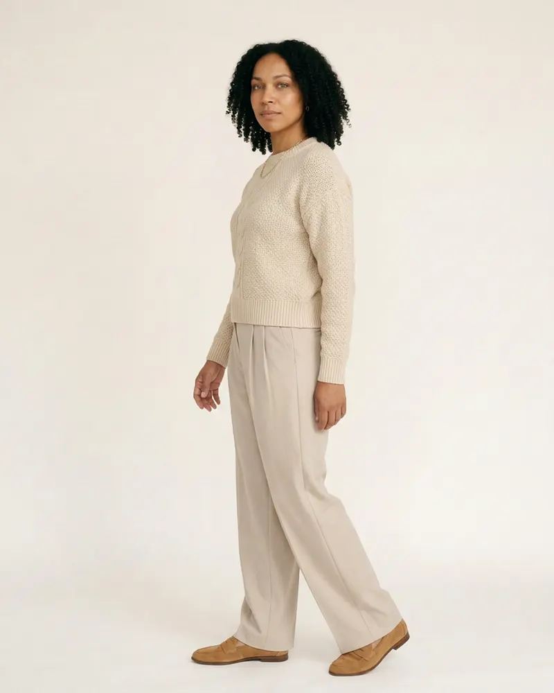 Alnmouth Cable-Knit Jumper in Ecru, three-quarter view showing the drape