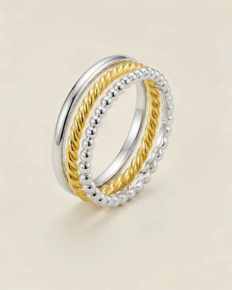 Aurelia Stacking Ring Set in Mixed Metal: three fine 1.5mm bands, one plain, one twisted and one beaded, stacked on one finger