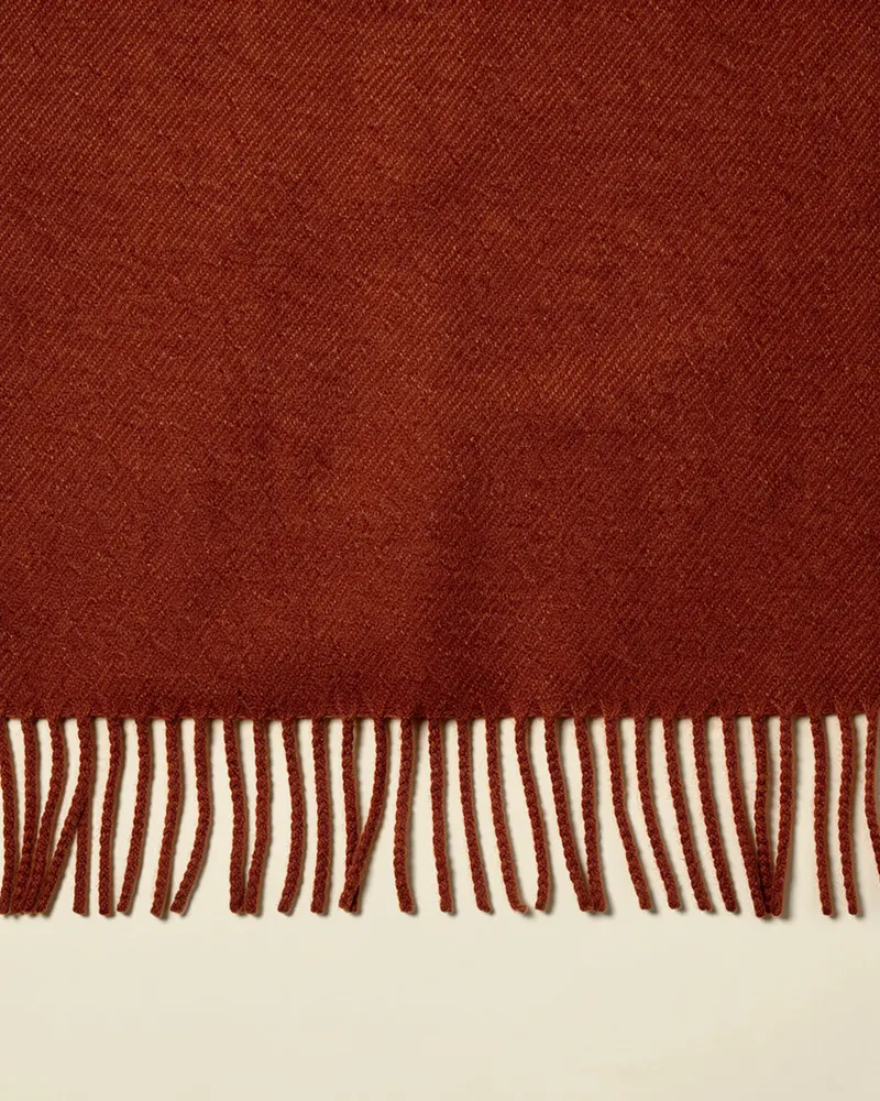 Close-up of the Fringed Lambswool Scarf in Rust: lambswool twill