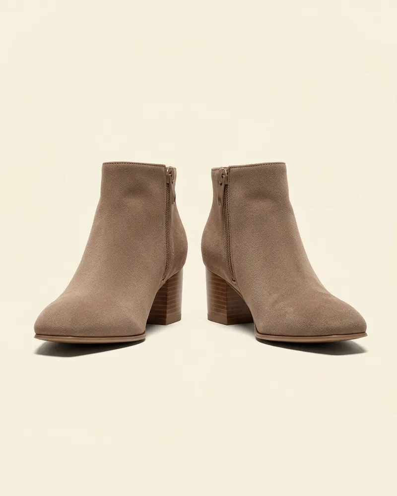 Greta Suede Ankle Boot in Taupe, a pair shown at three-quarters: almond-toe suede ankle boots on a 6cm block heel with a side zip