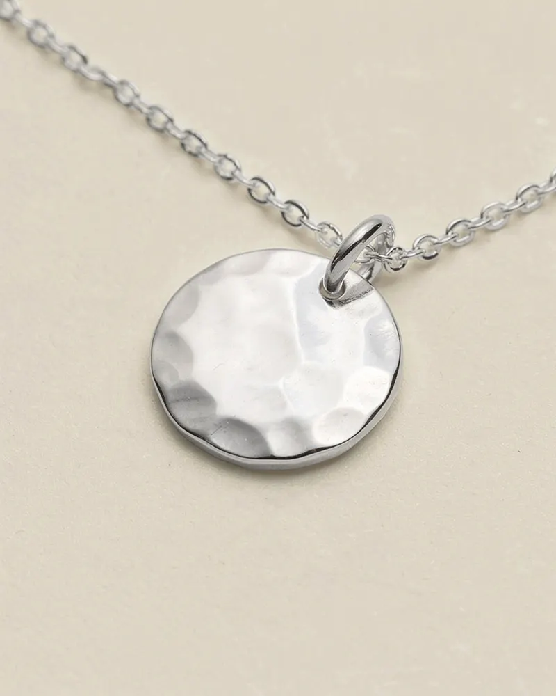 Close-up of the Hammered Disc Necklace in Recycled Silver: hand-hammered 12mm disc