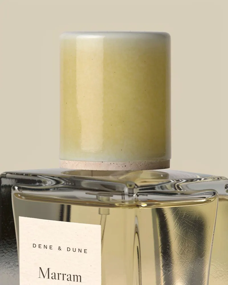 Close-up of the Marram Eau de Parfum: hand-glazed stoneware cap in butter yellow