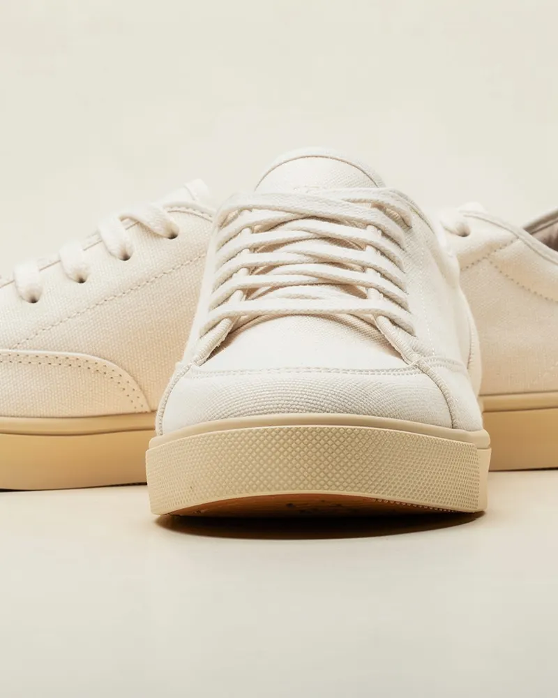 Close-up of the Organic Canvas Trainer in Ecru: organic cotton canvas