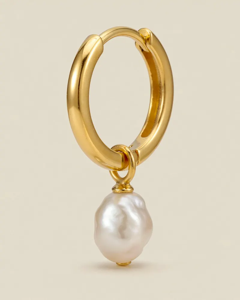 Close-up of the Pearl Charm Huggie Hoop Earrings in Gold Vermeil: 15mm hinged huggie hoops