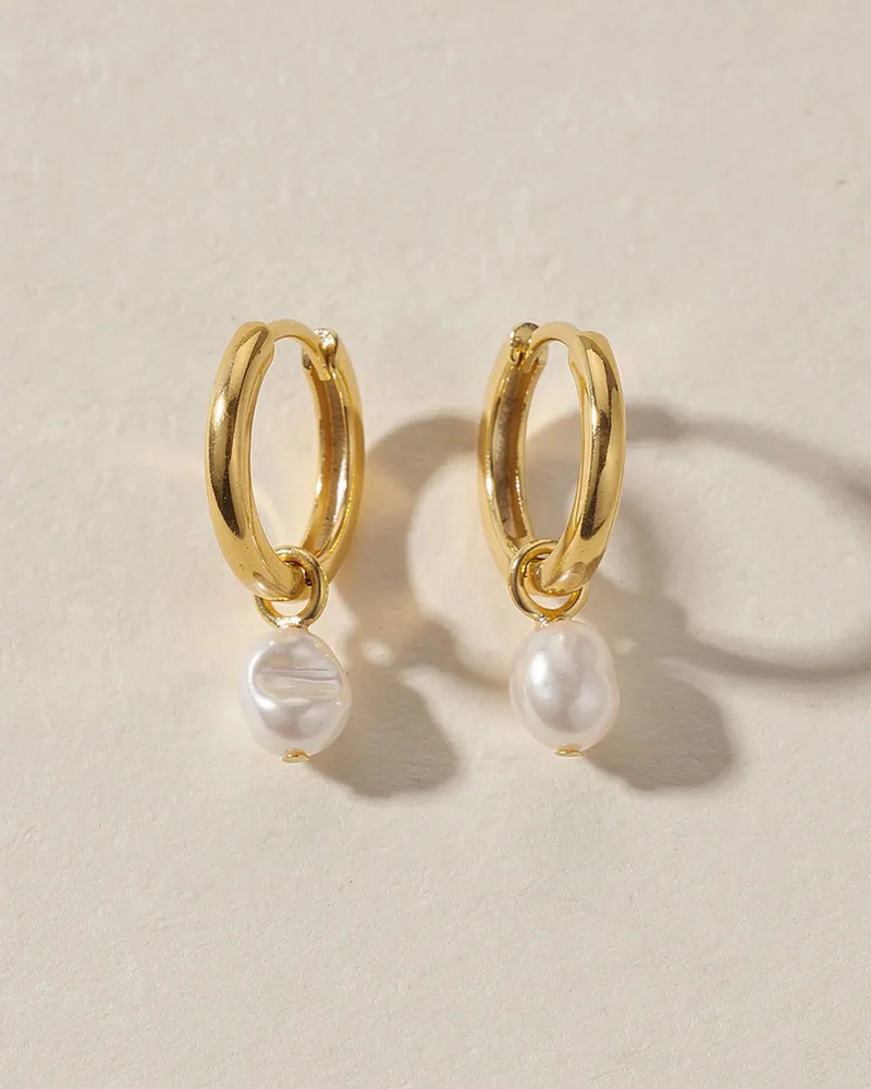 Pearl Charm Huggie Hoop Earrings in Gold Vermeil: small 15mm hinged gold vermeil hoops, each with a removable baroque freshwater pearl charm