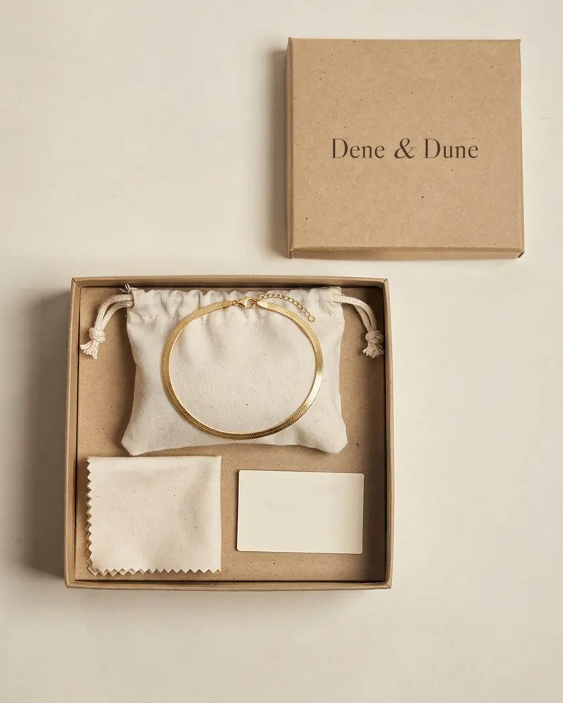 Ross Sands Herringbone Necklace in Gold Vermeil in its Dene & Dune gift box with pouch and care card