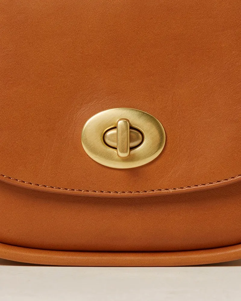 Close-up of the Sadie Leather Crossbody Bag in Tan: vegetable-tanned leather