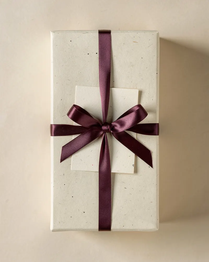 Sea Coal Eau de Parfum gift-wrapped with a handwritten message card