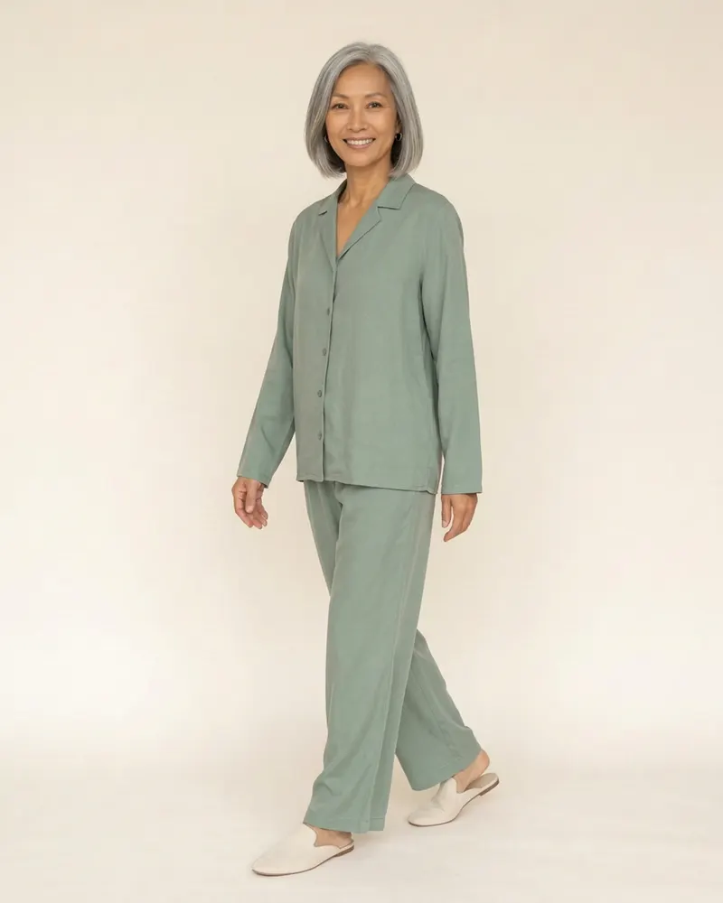 Solène Silk Pyjama Set in Sage, three-quarter view showing the drape